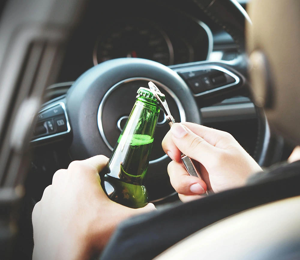 Low Range Drink Driving (PCA) opening a bottle